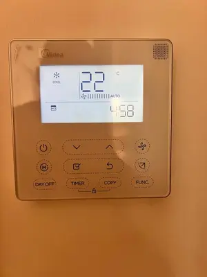 an electronic thermostat on a wall at Villa familiale avec piscine chauffée La Dolce Vita in Marrakech