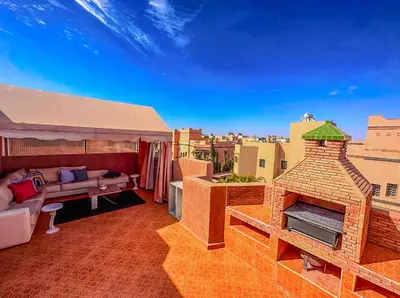 a living room with a brick fireplace on a roof at Rare ! duplex avec vue sur les toits de Marrakech in Marrakech