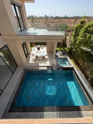 an overhead view of a swimming pool in a house at Villa Kenza piscine et jacuzzi chauffée in Marrakech