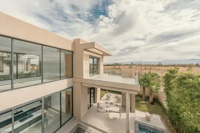 an aerial view of a house with glass windows at Villa Kenza piscine et jacuzzi chauffée in Marrakech
