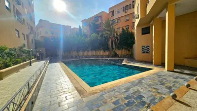 a swimming pool in the middle of a building at Best Apartment Marrakech G35 in Marrakech