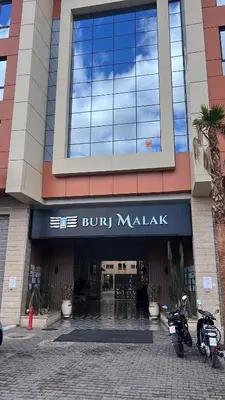 a building with motorcycles parked in front of it at Best Apartment Marrakech G35 in Marrakech