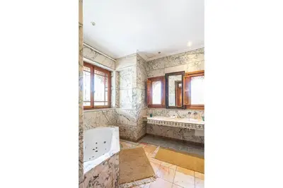 a bathroom with a tub and two sinks and a bath tub at Villa palmeraie marrakech in Marrakech