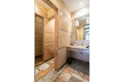 a bathroom with a sink and a mirror at Villa palmeraie marrakech in Marrakech