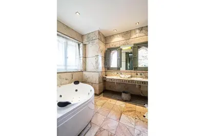 a large bathroom with a tub and a sink at Villa palmeraie marrakech in Marrakech