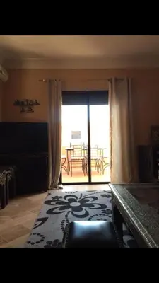a room with a large window with a view of a patio at مراكش in Marrakech