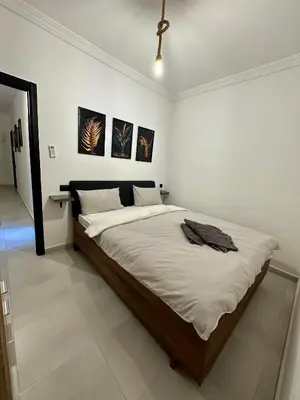 a bedroom with a large bed in a room at Luxury Appartement Marjane in Marrakech