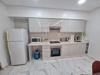 a kitchen with white appliances and a white refrigerator at Kech vacations FRIENDLY! 2 bedroom luxury apartment in Marrakech