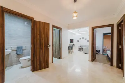 a bathroom with a toilet and a sink at Confortable & Très Bien Noté - Vue Piscine, Proche M Avenue, Piscine, Fibre Optique, Parking in Marrakech
