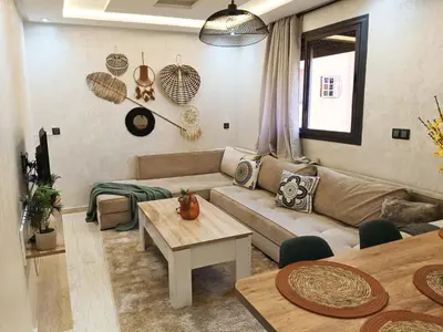 a living room with a couch and a table at Marrakech appart in Marrakech