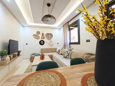 a living room with a couch and a table at Marrakech appart in Marrakech