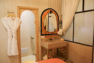 a bathroom with a sink and a mirror at Riad 10 Mandarin BOUTIQUE RIAD in Marrakech