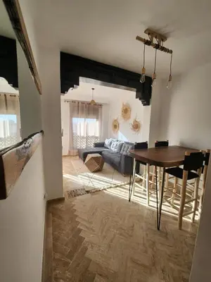 a living room with a couch and a table at Dar Atlas Lula in Marrakech