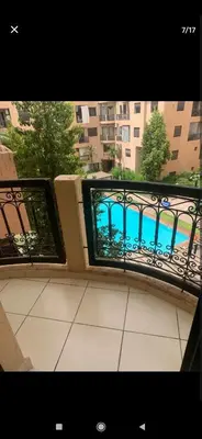 a balcony with a view of a swimming pool at Marrakesh in Marrakech