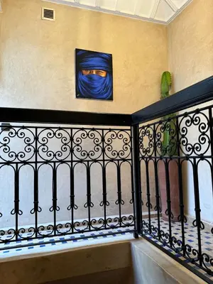 a painting of a man on a wall at Riad dar serenity in Marrakech