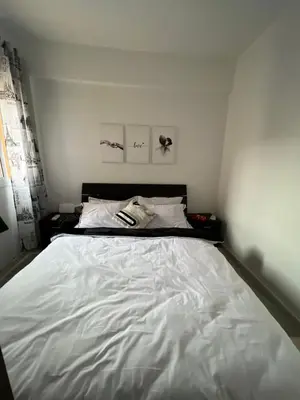 a bedroom with a large white bed in it at Portes de Marrakech in Marrakech