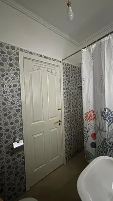 a bathroom with a white door and a sink at Marrakech menara in Marrakech
