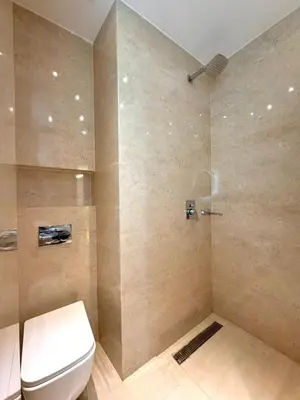 a bathroom with a toilet and a shower at Appartement Neuf et Moderne in Marrakech