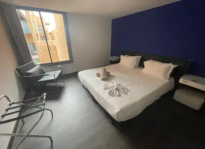 a bedroom with a bed with a teddy bear on it at Très Beau Duplexe avec piscine depuis la terrasse in Marrakech