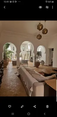 a large room with a large bed in the middle at Villa Bohème Havre de paix, piscine chauffée,4 Suites in Marrakech
