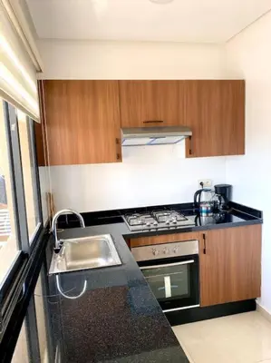a kitchen with a sink and a stove at Stylish Apartment IN Marrakech E25 in Marrakech