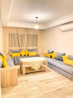a living room with a couch and a table at Apartment Comfortable Marrakech in Marrakech