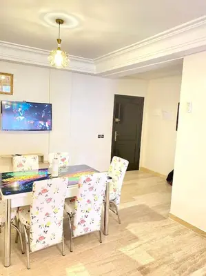 a dining room with a table and chairs at Apartment Comfortable Marrakech in Marrakech