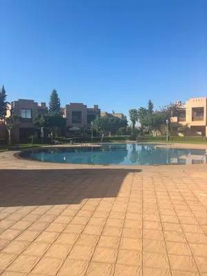 a swimming pool in the middle of a city at Marrakech Residence in Marrakech