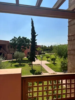 a view from a balcony of a garden at Marrakech Residence in Marrakech