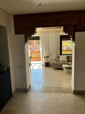 a living room with a couch and a table at Marrakech Residence in Marrakech
