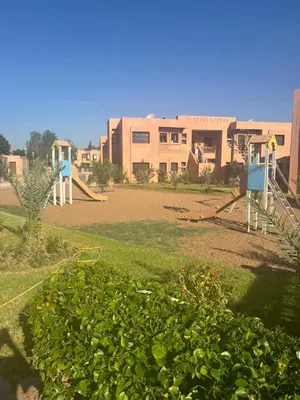 a school yard with a playground at Marrakech Residence in Marrakech
