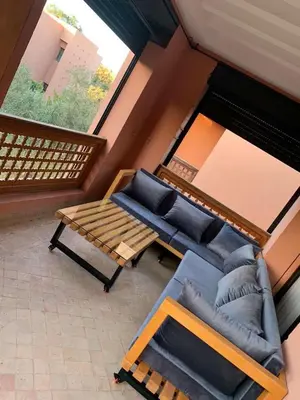 a living room with a couch and a table at Marrakech Residence in Marrakech