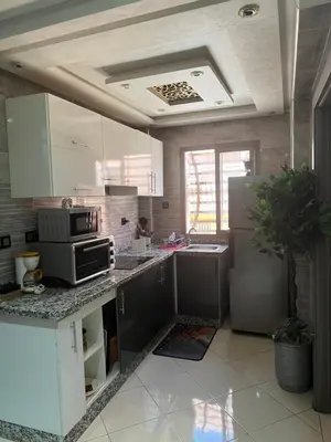 a kitchen with stainless steel appliances at Appartement moderne a guéliz in Marrakech