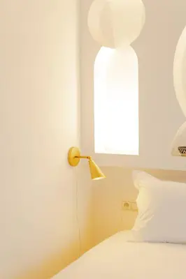 a bedroom with a bed with a lamp on it at Boutique Hotel La Maison dArts et Medicine in Marrakech