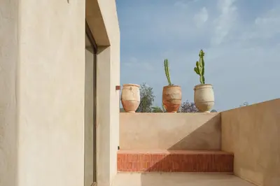 a group of pots sitting on top of a wall at Villa Saman in Marrakech