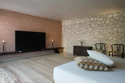 a living room with a bed and a flat screen tv at Villa Saman in Marrakech