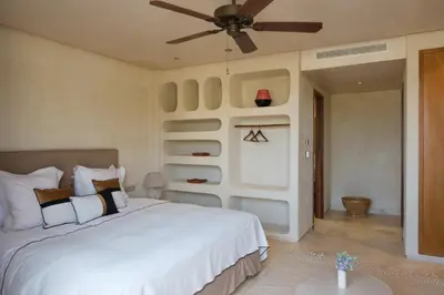 a bedroom with a bed and a ceiling fan at Villa Saman in Marrakech