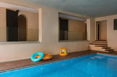 a swimming pool with toys next to a house at Villa Tamari in Marrakech