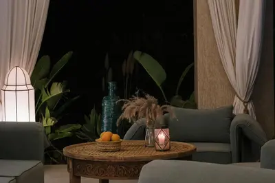 a living room with a table with fruit on it at Villa Netumia in Marrakech