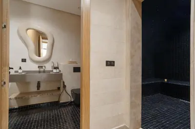 a bathroom with a sink and a shower at Villa Eyline Amelkis Golf in Marrakech