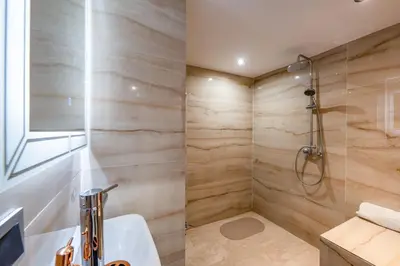 a bathroom with a shower and a sink at Modern Hivernage Duplex with Private pool in Marrakech