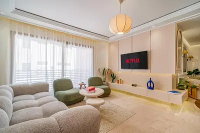 a living room with a couch and two chairs at Kasbel 2 Appart & Pool in Marrakech