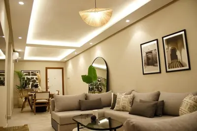 a living room with a couch and a table at Beldi Chic apartment in Marrakech in Marrakech