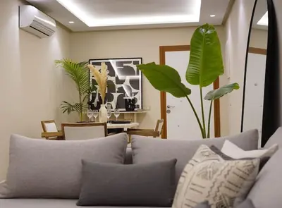a living room with a couch with pillows at Beldi Chic apartment in Marrakech in Marrakech
