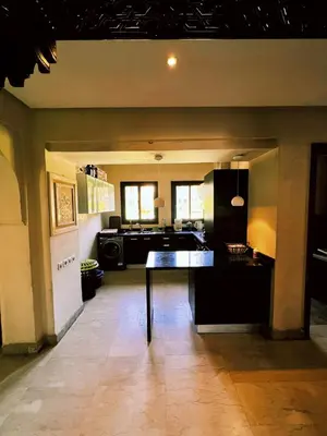 a kitchen with a table in the middle of a room at Casa Lina in Marrakech