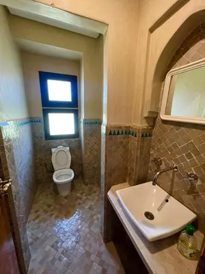 a bathroom with a sink and a toilet at Casa Lina in Marrakech