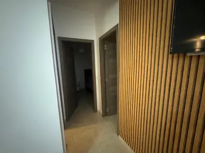 a room with a hallway with a door and a mirror at Joli appartement nouveau Rez-de-chaussée in Marrakech