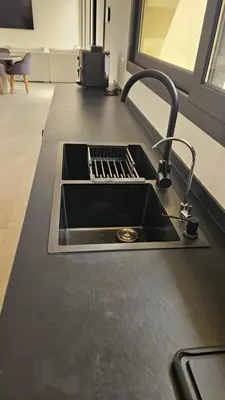 a kitchen sink with a faucet on a counter at Villa Dar Maryam in Marrakech