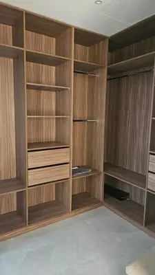 a large wooden closet with wooden shelves at Villa Dar Maryam in Marrakech