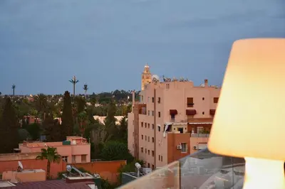 a view of a city with buildings and a lamp at Hevernage penthouse in Marrakech